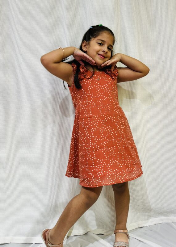 Little girl in mul cotton polka dot dress