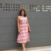 A girl in hand block printed cotton pink dress