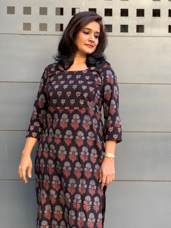 Black ajrakh kurti with yoke highlighted in hand-embroidery